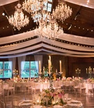 Candelabra Wrapped in Vines
Photography: Ira Lippke Studios
Read More:
http://www.insideweddings.com/weddings/a-lakeside-black-tie-wedding-with-a-summer-camp-theme/938/ candelabra wrapped with vines and surrounded by pink and white flowersq
