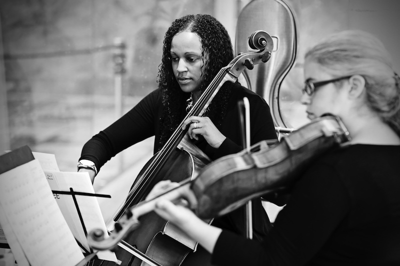 Chicago Sinfonietta String Quartet
Photography: Carasco Photography
Read More:
http://www.insideweddings.com/weddings/city-wedding-at-chicago-planetarium-with-purple-yellow-palette/688/ Black and white photo of a cellist and violinist from the Chicago Sinfonietta at wedding ceremony