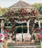 Floral-Embellished Gazebo
Photography: Shannon’s Photography
Read More:
http://www.insideweddings.com/weddings/summer-wedding-with-garden-inspired-decor-in-california/50/ Flowers decorate ceremony gazebo