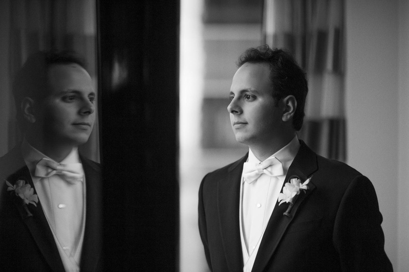 White Bow Tie
Photography: Justin Marantz
Read More:
http://www.insideweddings.com/weddings/unforgettable-miami-wedding-with-acrobats-tiger-cubs-fireworks/437/ Black and white photo of groom looking at reflection