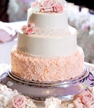 Three-Layer Ivory %26 Blush Cake
Photography: Bob %26 Dawn Davis Photography
Read More:
http://www.insideweddings.com/weddings/glamorous-ballroom-wedding-with-personalized-details-in-chicago/952/ Wedding cake with flower rosette piping on base, buttercream frosting, fresh flowers on top