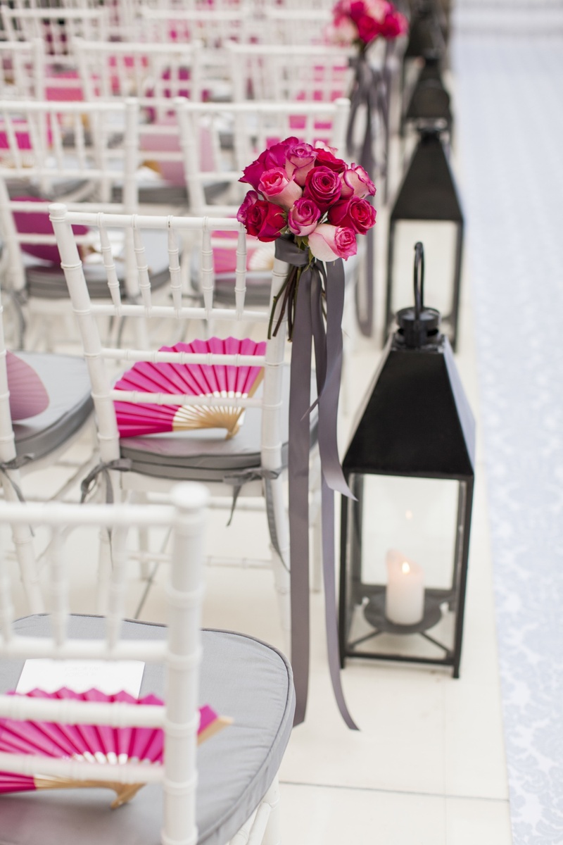 Lantern Aisle Décor
Photography: Embrace Life Photography
Read More:
http://www.insideweddings.com/weddings/santa-monica-poolside-wedding-with-a-modern-tropical-feel/548/ White ceremony aisle with black lanterns and roses