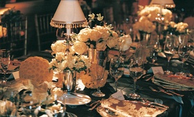 Gold and Black Reception Table and Decor
Photography: Dalal Photography
Read More:
http://www.insideweddings.com/weddings/old-world-elegance-at-classic-ballroom-wedding-in-san-francisco/85/ white flowers and lampshades decorate table