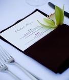 Beach Wedding Place Setting
Photography: David Michael Photography
Read More:
http://www.insideweddings.com/weddings/cool-classic-california-wedding-with-unique-guestbook/249/ Brown napkin with green orchid at wedding place setting