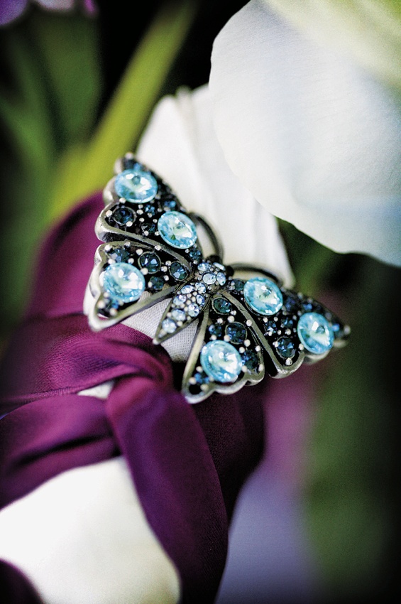 Bouquet Accent
Photography: Chris + Lynn Photographers
Read More:
http://www.insideweddings.com/weddings/butterfly-inspired-spring-wedding-in-canada/189/ Wedding bouquet hand tied with red ribbon and decorated with a butterfly with blue crystals