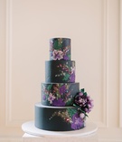 Black Cake with Floral Details
Photography: Sarah Pudlo %26 Co
Read More:
http://www.insideweddings.com/weddings/inspirational-wedding-shoot-with-bold-color-scheme-unique-details/1207/ black wedding cake with purple flower details