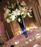White and Blue Centerpiece
Photography: Mitch Burmeister %26 Scott Preston
Read More:
http://www.insideweddings.com/weddings/glamorous-blue-white-wedding-at-the-bel-air-bay-club/104/ Tall vase holding vanilla blooms and greenery