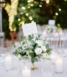 Arrangement of White Flowers and Greenery
Photography: Coco Tran
Read More:
http://www.insideweddings.com/weddings/alfresco-black-tie-wedding-at-a-historic-property-in-the-bay-area/1287/ wedding reception centerpiece with ranunculus, anemone, eucalyptus