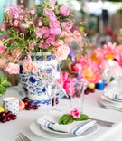 Striped Napkin with Pink Blossom
Photography: Maya Myers Photography
Read More:
http://www.insideweddings.com/weddings/colorful-tented-rehearsal-dinner-with-garden-elements-in-brooklyn/1188/ chinoiserie vases, pink flowers, blue and silver striped napkins topped with pink flower and leaves