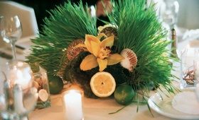 Beach Wedding Centerpiece
Photography: frame.thirty.six photography
Read More:
http://www.insideweddings.com/weddings/tropical-inspired-spring-wedding-at-the-bel-air-bay-club/236/ Small centerpiece with grass, lemon, lime, orchid, and sea shell decorations