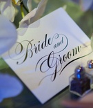 Sweetheart Table Number
Photography: Gruber Photographers
Read More:
http://www.insideweddings.com/weddings/opulent-new-york-city-wedding-with-violet-lighting/395/ Bride and Groom in script calligraphy font on stationery