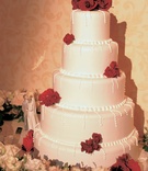 Five-Tier Cake with Red Roses
Photography: Epic Imagery
Read More:
http://www.insideweddings.com/weddings/jennifer-davis-and-ryan-bittle/43/ White cake with dots around tiers