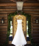 Strapless Wedding Dress on Hanger
Photography: Catherine Hall Studios
Read More:
http://www.insideweddings.com/weddings/rustic-classic-summer-wedding-in-lake-tahoe-california/645/ Vera Wang fit-and-flare gown with satin belt
