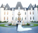 Bride & Groom in Front of Chateau