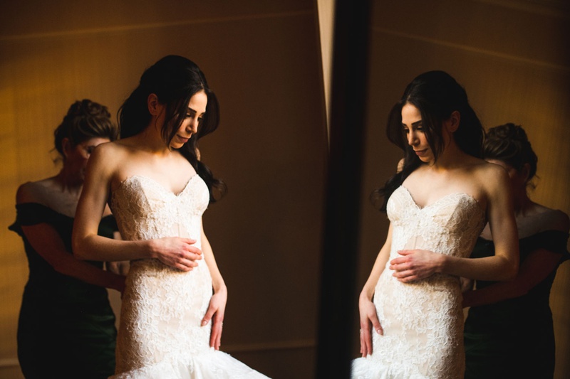 Bride Putting on Wedding Dress in Mirror
Photography: Mantas Kubilinskas Photography
Read More:
http://www.insideweddings.com/weddings/sophisticated-ceremony-ballroom-reception-in-washington-dc/1296/ bride in wedding dress sweetheart neckline mermaid trumpet skirt mirror bridal suite