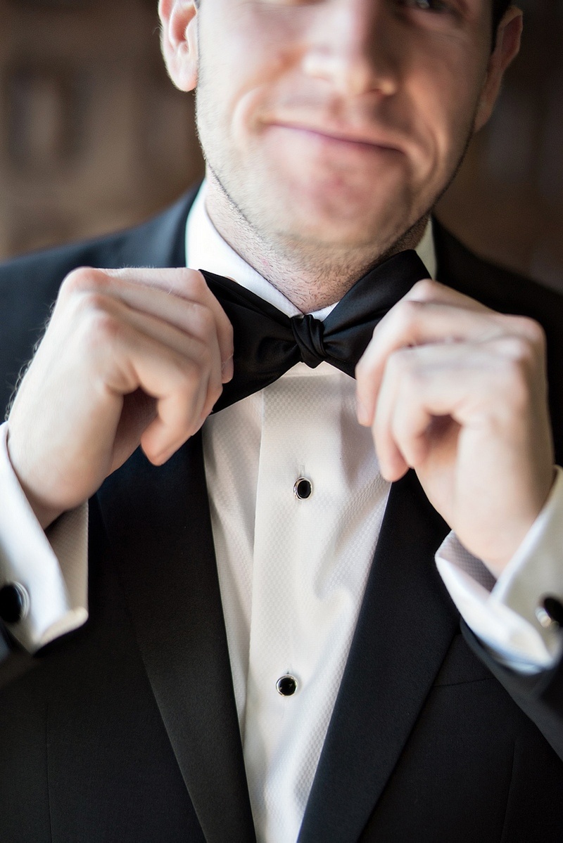 Groom Fixing His Bowtie
Photography: Laurie Bailey Photography
Read More:
http://www.insideweddings.com/weddings/oceanfront-wedding-ceremony-classic-romantic-ballroom-reception/854/ groom fixing his bowtie black white tuxedo smirk wedding