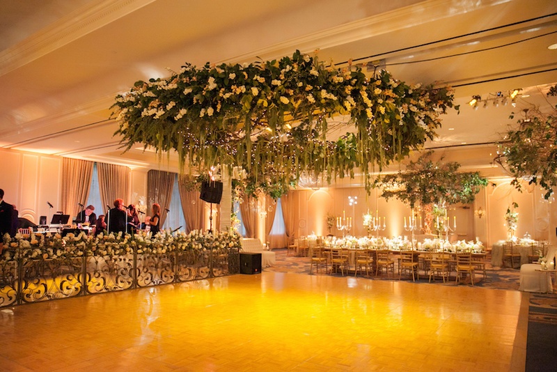 Dance Floor Flower Installation
Photography: Michael Carr Photography
Read More:
http://www.insideweddings.com/weddings/traditional-church-ceremony-forest-inspired-reception-in-houston/695/ Mirror wedding band stage and flower ceiling installation over dance floor