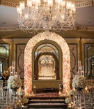 Ballroom Ceremony Entrance
Photography: Michael Falco for Christian Oth Studio
Read More:
http://www.insideweddings.com/weddings/formal-manhattan-wedding-with-opulent-ballroom-decor/517/ Flower arch and petal aisle under crystal chandelier