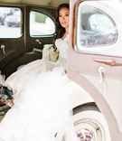 Bride Getting Into Vintage Car
Photography: Birds of a Feather
Read More:
http://www.insideweddings.com/weddings/church-ceremony-sparkling-pink-ballroom-reception-with-city-views/1084/ Bride in trumpet wedding dress getting into or out of a vintage packard car at ceremony