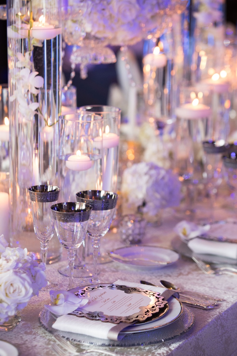 Silver-Rimmed Glassware
Photography: Collin Pierson Photography
Read More:
http://www.insideweddings.com/weddings/winter-wedding-inspirational-shoot-with-opulent-frosted-decor/1108/ Wedding reception place setting menu card orchid silver rim champagne flute wine glass goblet