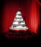 Spanish Romantic-Inspired Cake
Photography: John Solano Photography
Read More:
http://www.insideweddings.com/weddings/romantic-california-wedding-with-deep-red-details/318/ Five layer cake with black lace and roses