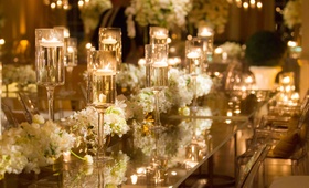 Contemporary Floating Candles
Photography: Denis Reggie Photographers
Read More:
http://www.insideweddings.com/weddings/lavish-white-gold-country-club-wedding-in-houston-texas/416/ White and gold wedding decorations with clear table