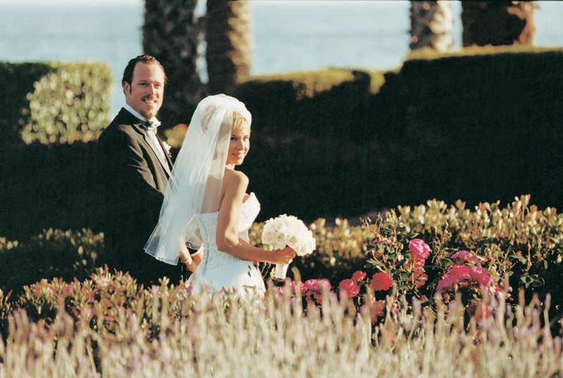 Bride and Groom in Garden
Photography: Isabel Lawrence Photographers
Read More:
http://www.insideweddings.com/weddings/romantic-seaside-wedding-at-the-biltmore-in-santa-barbara/76/ Newlyweds take a stroll with an ocean view