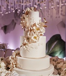 Sugar Flower Cake Inspired by Gown
Photography: Christian Oth Studio
Read More:
http://www.insideweddings.com/weddings/traditional-cathedral-wedding-luxury-reception-in-new-york-city/1331/ ron ben israel wedding cake white and gold with sugar flowers cascading down tiers