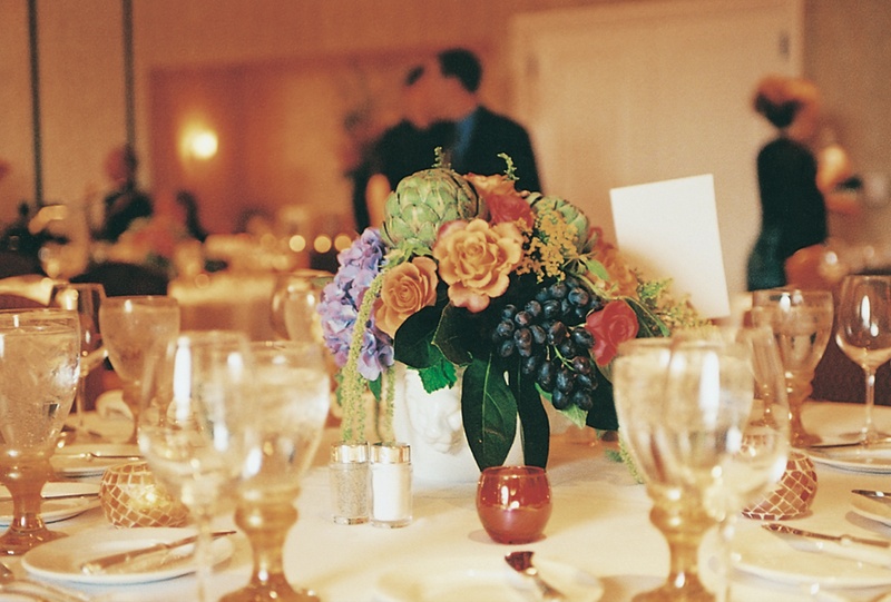 Artichoke %26 Grape Centerpiece
Photography: Tina Carlone Photography
Read More:
http://www.insideweddings.com/weddings/mediterranean-inspired-newport-beach-wedding/39/ Flower centerpiece with artichokes and grapes