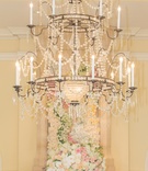 Ballroom Crystal Chandelier
Photography: Thisbe Grace Photography
Read More:
http://www.insideweddings.com/weddings/inspirational-wedding-shoot-inspired-by-geology-glam-textures/678/ Wedding reception with crystal chandelier, arrangement of white, pink, light orange roses, orchids