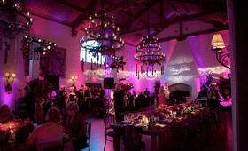Purple %26 Pink Reception Lighting
Photography: Ira Lippke Studios
Read More:
http://www.insideweddings.com/weddings/gemstone-colored-affair-in-southern-california/266/ Reception room with chandeliers and vibrant lighting