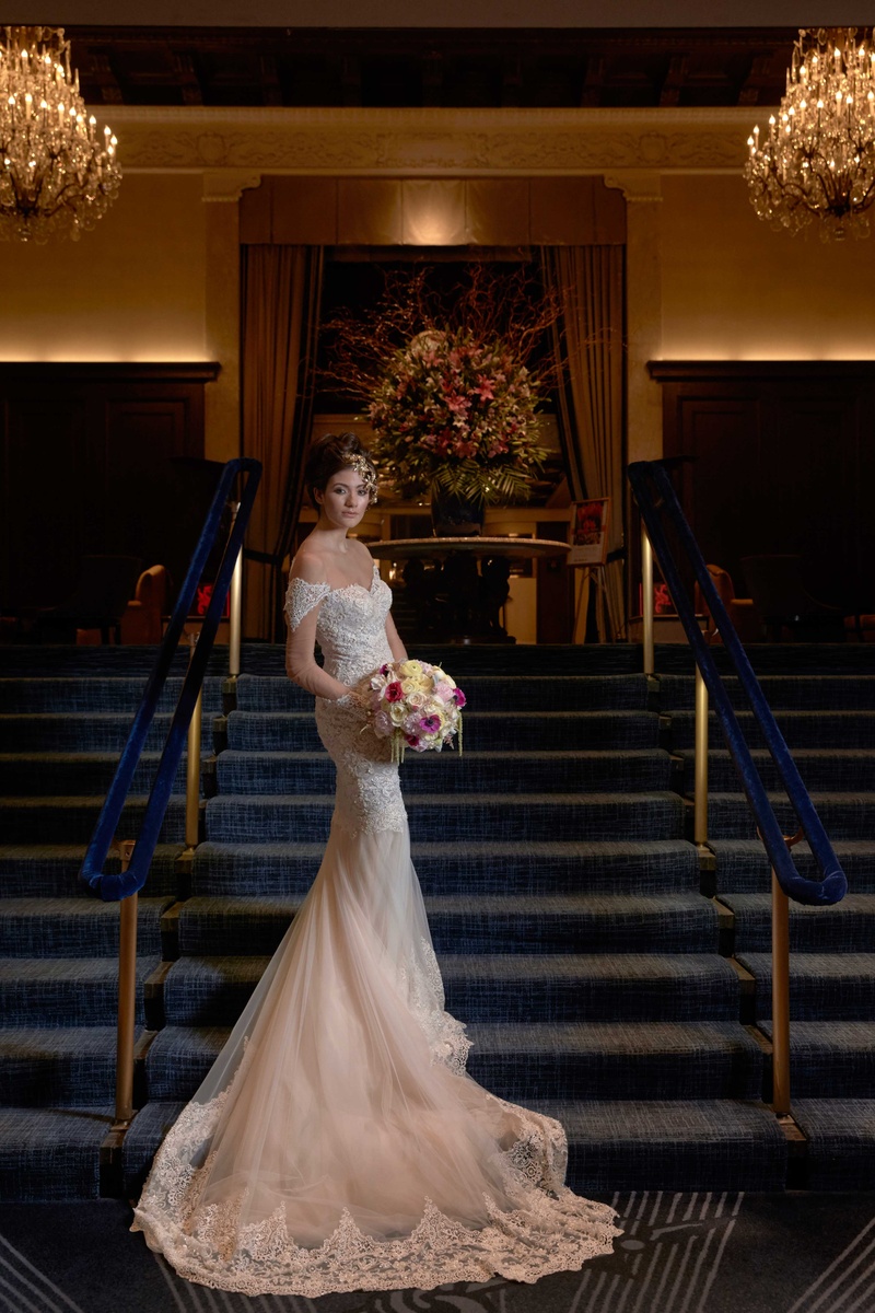 Bride in Lace Gown with Bouquet on Stairs
Photography: Collin Pierson Photography
Read More:
http://www.insideweddings.com/weddings/bold-and-bright-wedding-styled-shoot-inspired-by-marrakesh-morocco/825/ lace bridal gown sweetheart neckline sleeves long train blush pink and white bouquet