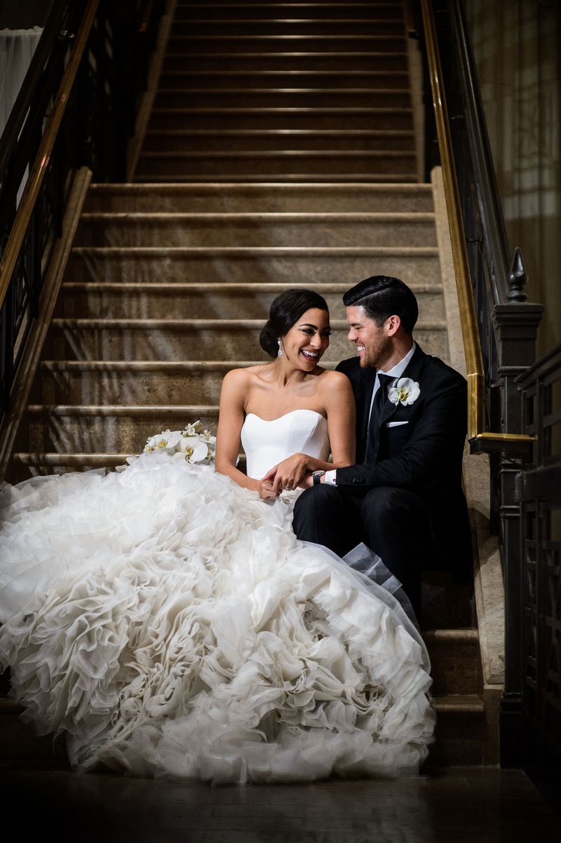 Bride %26 Groom on Staircase in Houston
Photography: Chris Bailey Photography
Read More:
http://www.insideweddings.com/weddings/modern-elegant-ballroom-wedding-with-white-flowers-in-houston/1246/ wedding portrait bride in pretty ines di santo wedding dress with ruffle texture skirt groom suit