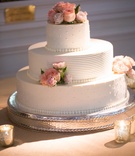Traditional Wedding Cake
Photography: Aaron Watson Photography
Read More:
http://www.insideweddings.com/weddings/classic-virginia-wedding-inspired-by-grace-kellys-elegance/511/ White wedding cake with Swiss dots and fresh pink roses on top