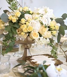 Yellow and White Flower Arrangement
Photography: Carasco Photography
Read More:
http://www.insideweddings.com/weddings/inspirational-wedding-shoot-with-light-fresh-color-palette/1167/ centerpiece in gold container, small yellow roses, white flowers, eucalyptus leaves, ivy