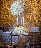 Ivory Wedding Table in Front of Flower Wall
Photography: Kevin Beasley Photographer
Read More:
http://www.insideweddings.com/weddings/opulent-wedding-with-gatsby-inspired-theme-at-louisiana-plantation/747/ Tall flower arrangement centerpiece with white orchid and ivory rose flowers in front of flower wall