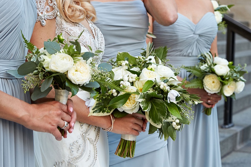 Ivory Garden Rose Bouquets
Photography: KingenSmith
Read More:
http://www.insideweddings.com/weddings/modern-romantic-wedding-with-glam-geometric-details-in-chicago/1171/ Bride in jewel wedding dress bridesmaids in light blue dresses bouquet greenery fern leaf white rose