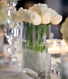 White Tulips in Rectangular Vase
Photography: Jasmine Star Photography
Read More:
http://www.insideweddings.com/weddings/inspired-bridal-shower-a-dazzling-day-of-delights/489/ White tulips and floating candles
