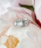 Halo Engagement Ring with Three Stones
Photography: KingenSmith
Read More:
http://www.insideweddings.com/weddings/elegant-wedding-with-blush-ivory-and-gold-palette-in-chicago/769/ Three stone diamond engagement ring with three halo settings and diamond band