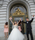 Bride %26 Groom Celebrating at City Hall
Photography: Chung Li Photography
Read More:
http://www.insideweddings.com/weddings/romantic-city-hall-wedding-with-korean-influences-in-san-francisco/707/ Bride in Kenneth Pool ball gown and groom in tuxedo with hands in air at San Francisco City Hall