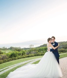 Newlywed Embrace
Photography: Mikel Healey Photography
Read More:
http://www.insideweddings.com/weddings/romantic-secret-garden-inspired-wedding-in-southern-california/1341/ bride in vera wang ball gown hugging groom in navy blue tuxedo on lawn overlooking ocean