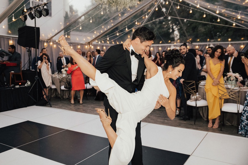 Bride %26 Groom Doing Lift on Dance Floor
Photography: Sam %26 Sola Lee Photography
Read More:
http://www.insideweddings.com/weddings/modern-outdoor-ceremony-tent-reception-in-seattle-on-puget-sound/1309/ bride in one shoulder jumpsuit for first dance cool lift dance lessons groom holding bride tent