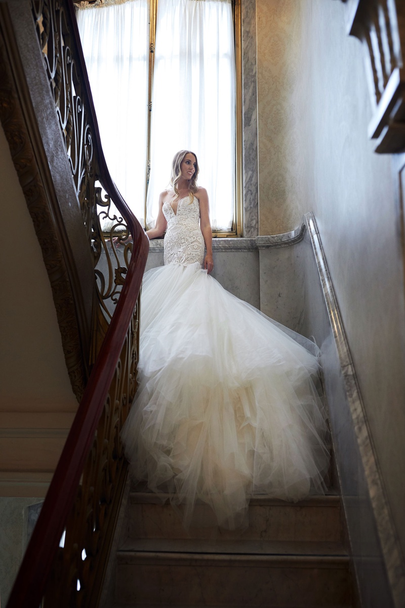 Bride in Stunning Gown in Stairway
Photography: Christian Oth Studio
Read More:
http://www.insideweddings.com/weddings/traditional-cathedral-wedding-luxury-reception-in-new-york-city/1331/ bride in galia lahav wedding dress from bridal reflections drop waist trumpet gown tulle skirt long