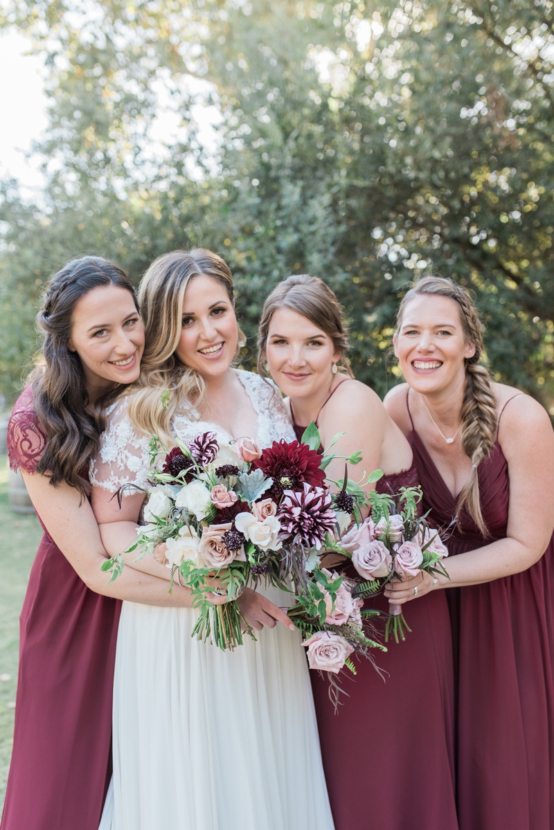 Bridesmaids Hugging Bride
Photography: Hello Blue Photo
Read More:
http://www.insideweddings.com/weddings/boho-chic-wedding-with-traditional-jewish-ceremony-in-malibu/1156/ bride in jina couture bridal gown, lace short sleeves, bridesmaids in marsala