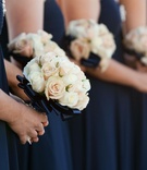 Ivory and Blue Bouquets
Photography: Joe Buissink Photography
Read More:
http://www.insideweddings.com/weddings/navy-pilots-dreamy-seaside-celebration-in-california/333/ Cream and pale pink roses wrapped in navy ribbon