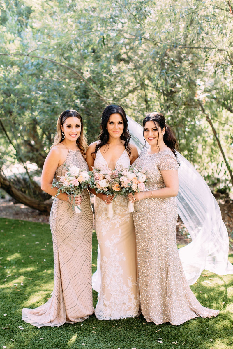 Beaded Bridesmaid Gowns
Photography: Ashley Paige Photography
Read More:
http://www.insideweddings.com/weddings/elegant-outdoor-fall-wedding-at-a-rustic-chic-venue-in-malibu/1244/ Bride in Calla Blanche wedding dress bridesmaids in adrianna papell bridesmaid dresses sequin beads