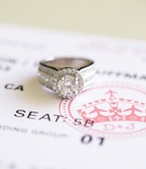Round Halo Engagement Ring
Photography: Troy Grover Photographers
Read More:
http://www.insideweddings.com/weddings/jet-setter-couples-modern-wedding-with-travel-inspired-elements/528/ Diamond ring on top of airline ticket save-the-date