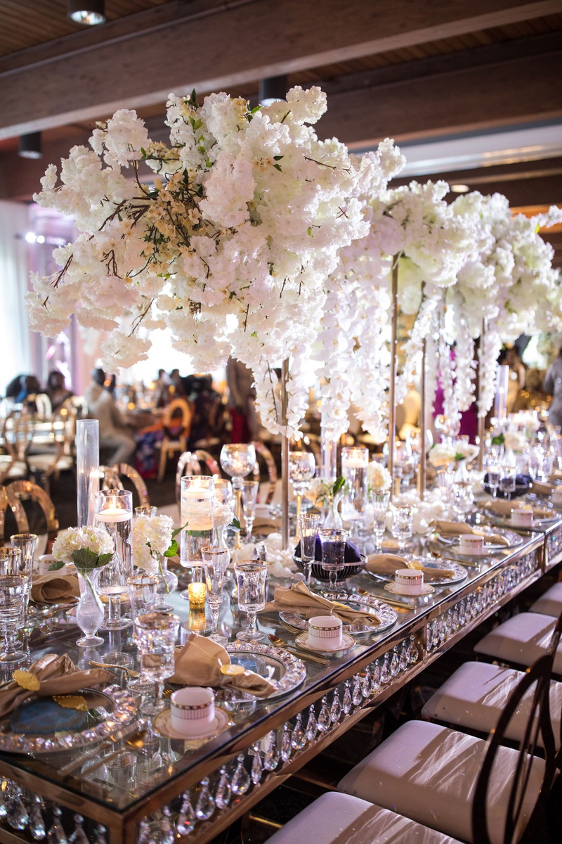 Crystal-Embellished Long Reception Table
Photography: Brian Bossany Photography
Read More:
http://www.insideweddings.com/weddings/luxurious-heaven-inspired-royal-wedding-celebration-in-minneapolis/1333/ wedding reception long table with crystals in between top and bottom crystal charger mirror top
