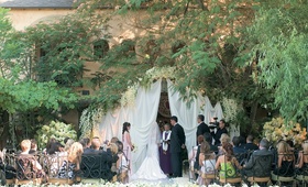 Courtyard Ceremony
Photography: Simone %26 Martin Photography
Read More:
http://www.insideweddings.com/weddings/joanna-last-and-ron-darling/111/ Courtyard ceremony decorated with draping, and light green and white flowers