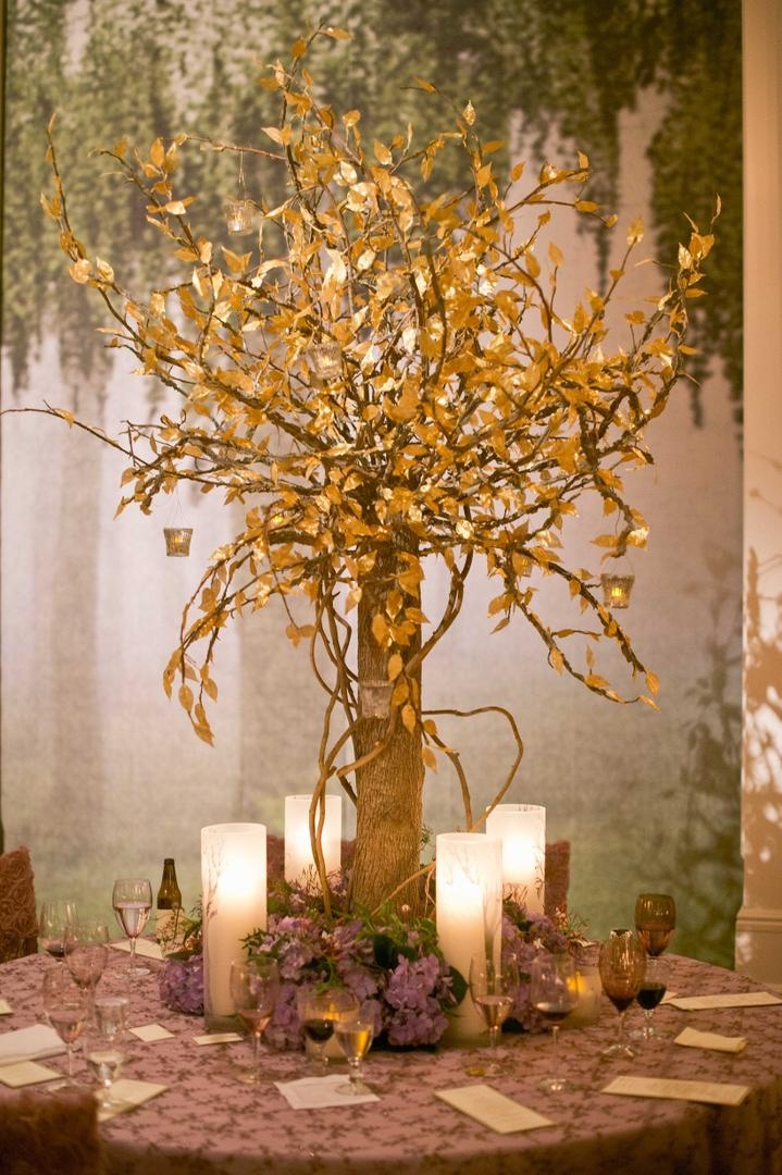 Golden Tree Centerpiece
Photography: Harwell Photography
Read More:
http://www.insideweddings.com/weddings/romantic-woodland-inspired-atlanta-wedding-with-natural-details/433/ Woodsy wedding with tree trunk centerpiece and gold leaves